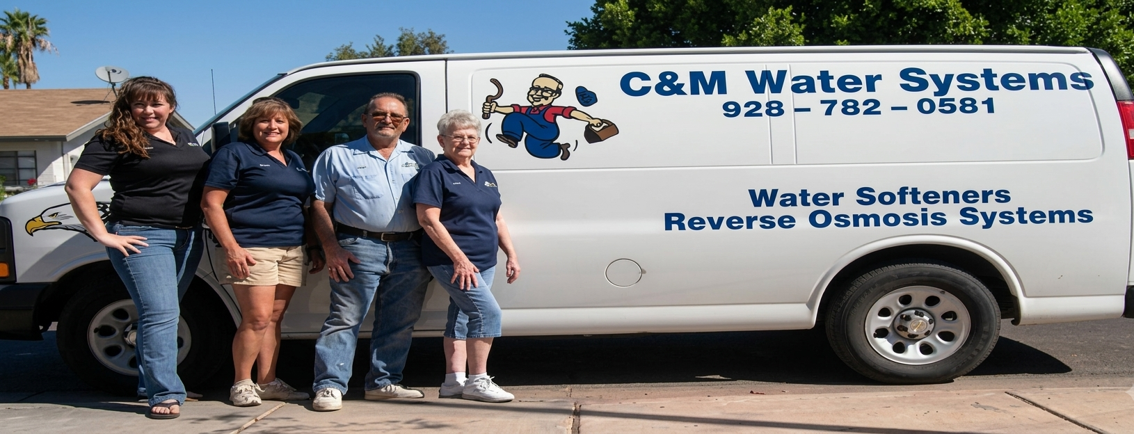 The C&M Water Systems family standing by their service van in Yuma